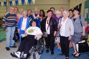 PICTURED L-R: Alan Landsman, Millie Graye, Janet (swim-in client with aide), Phyllis Betancourt, Marcia Levy, Ruth Kornheiser, Susan Siegel, Nick Silecchio, Karen Sandberg, Henrietta Wolfeiler, Jane Moser, Arlene Sugarman, Dora Graye, Patti Pasquino (National Multiple Sclerosis Society liaison with Swim-In program).