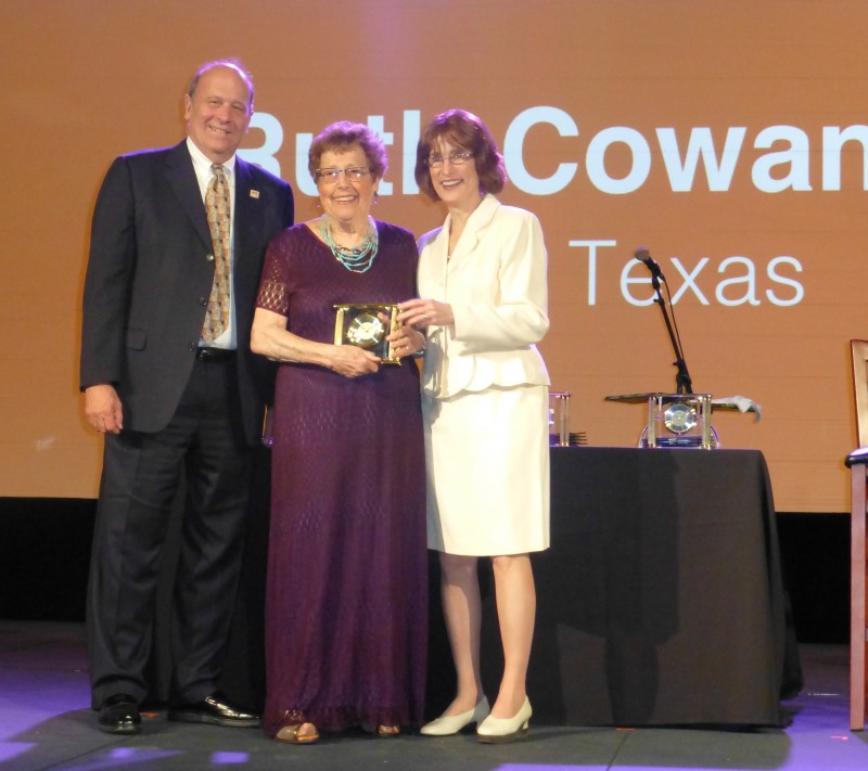 Ruth Cowan receiving award facing camera