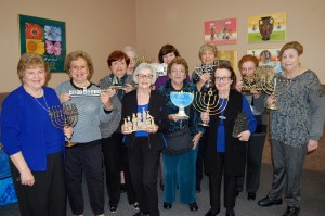 Group holding menorahs - reduced