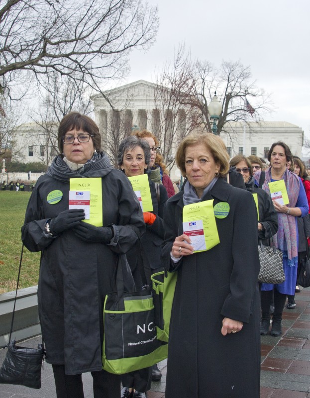 National Council of Jewish Women (NCJW) CEO Nancy Kaufman (left) and National President Debbie Hoffmann (right) led nearly 400 women from the U.S. Supreme Court to the U.S. Capitol, to call on U.S. Senator Chuck Grassley (R-IA) and the rest of the U.S. Senate Judiciary Committee to consider President Obama's Supreme Court nominee. As part of the action, each woman carried a copy of the U.S. Constitution and personally signed messages to be delivered to Grassley. The demonstration came in response to Senate Republicans' stated refusal not to consider any nominee the President put forward, which NCJW considers an obstruction of justice.