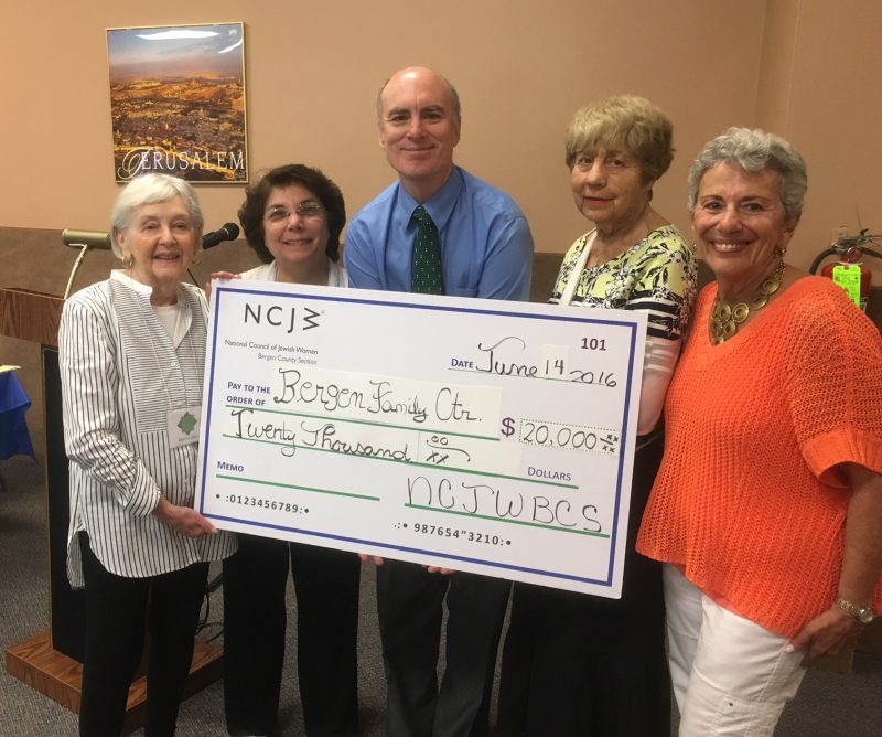 Mitch Schonfeld, MSW, President and CEO of Bergen Family Center, receives a check for $20,000 from members of the board of NCJW. The funding, a bequest from NCJW member Renee Guller, will allow the Center to create the National Council of Jewish Women/Renee Guller Infant Toddler Center at the BFC‘s Armory Street location in Englewood. 
